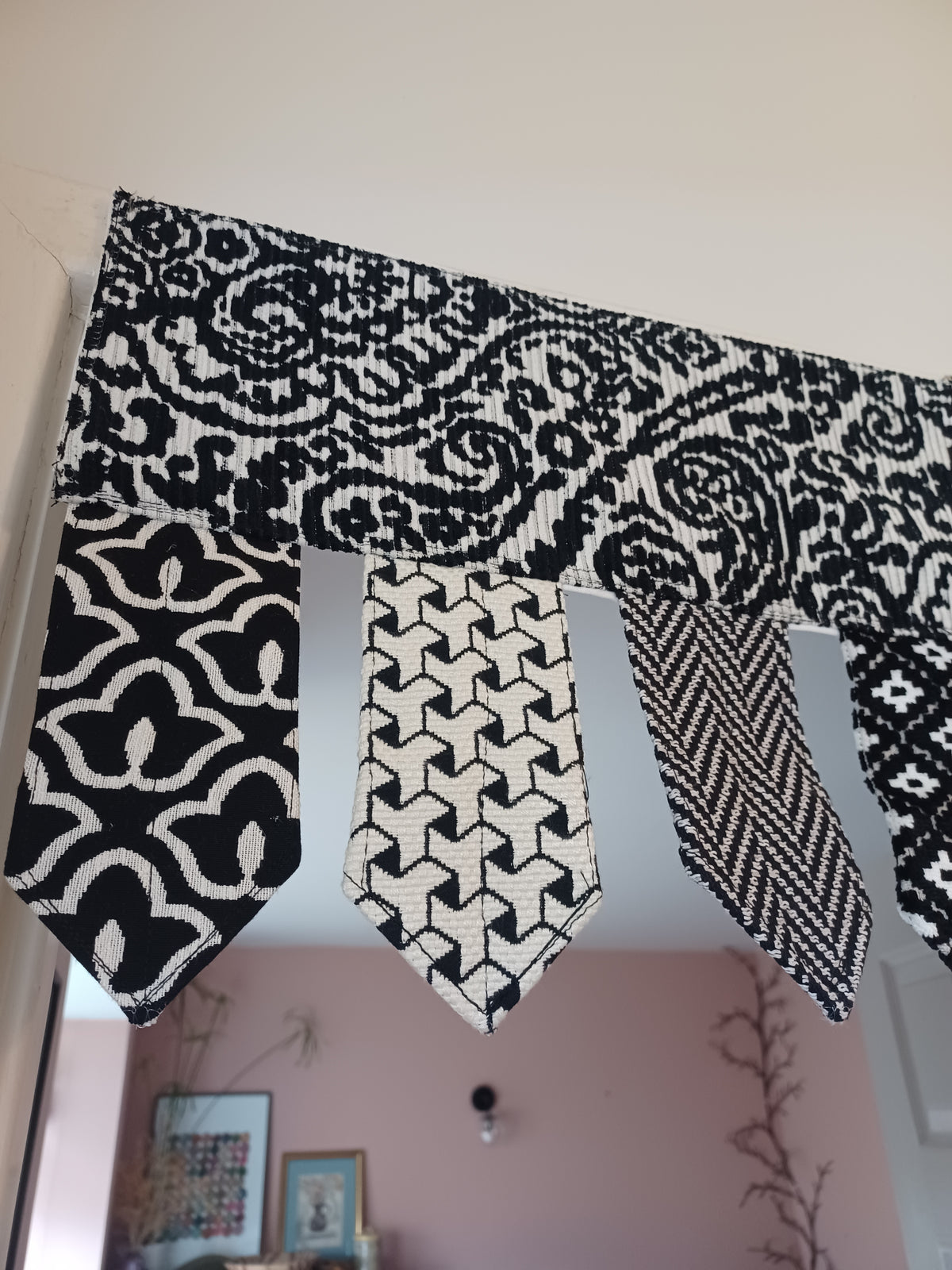 Handmade toran door hanging in shades of black and off-white