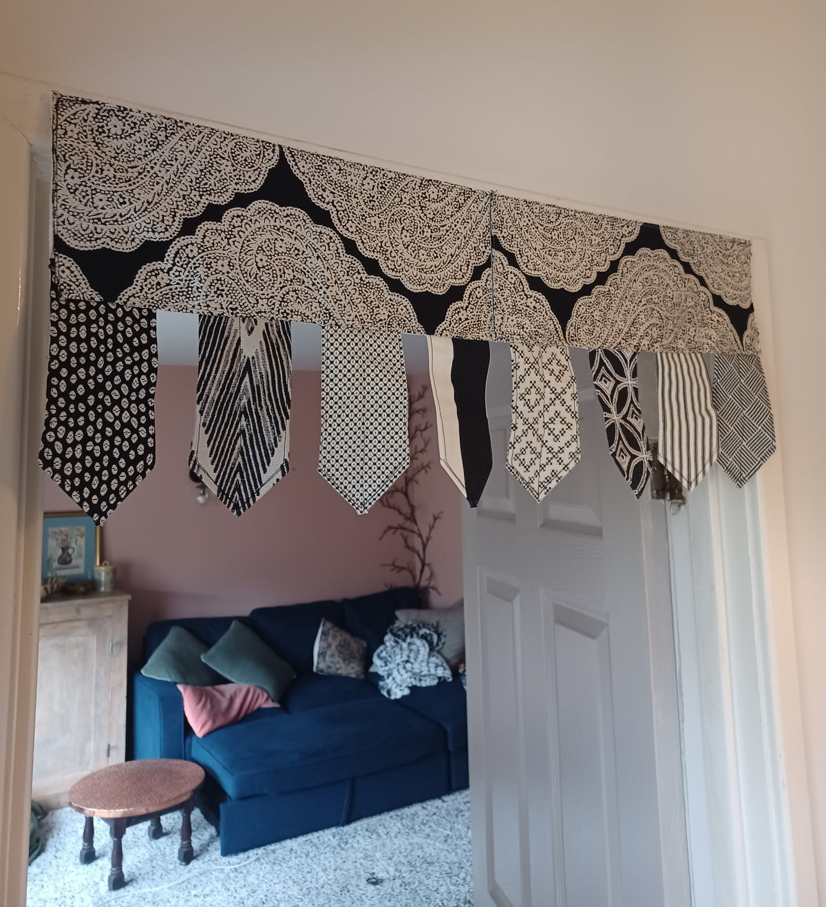 Handmade toran door hanging in shades of black and off-white
