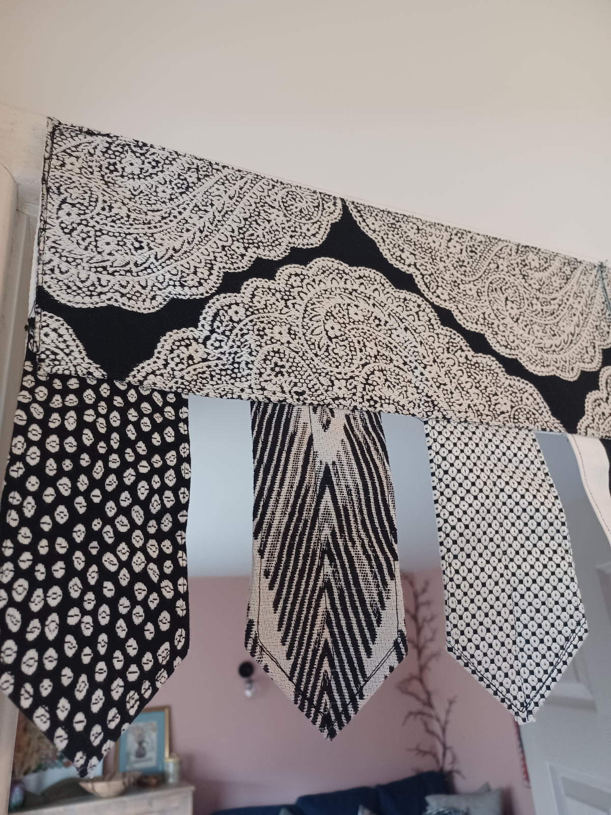 Handmade toran door hanging in shades of black and off-white