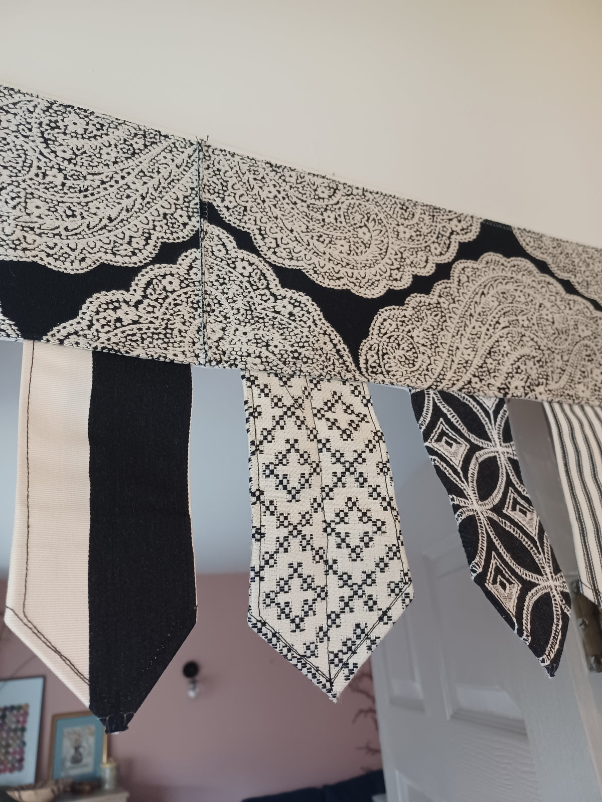 Handmade toran door hanging in shades of black and off-white