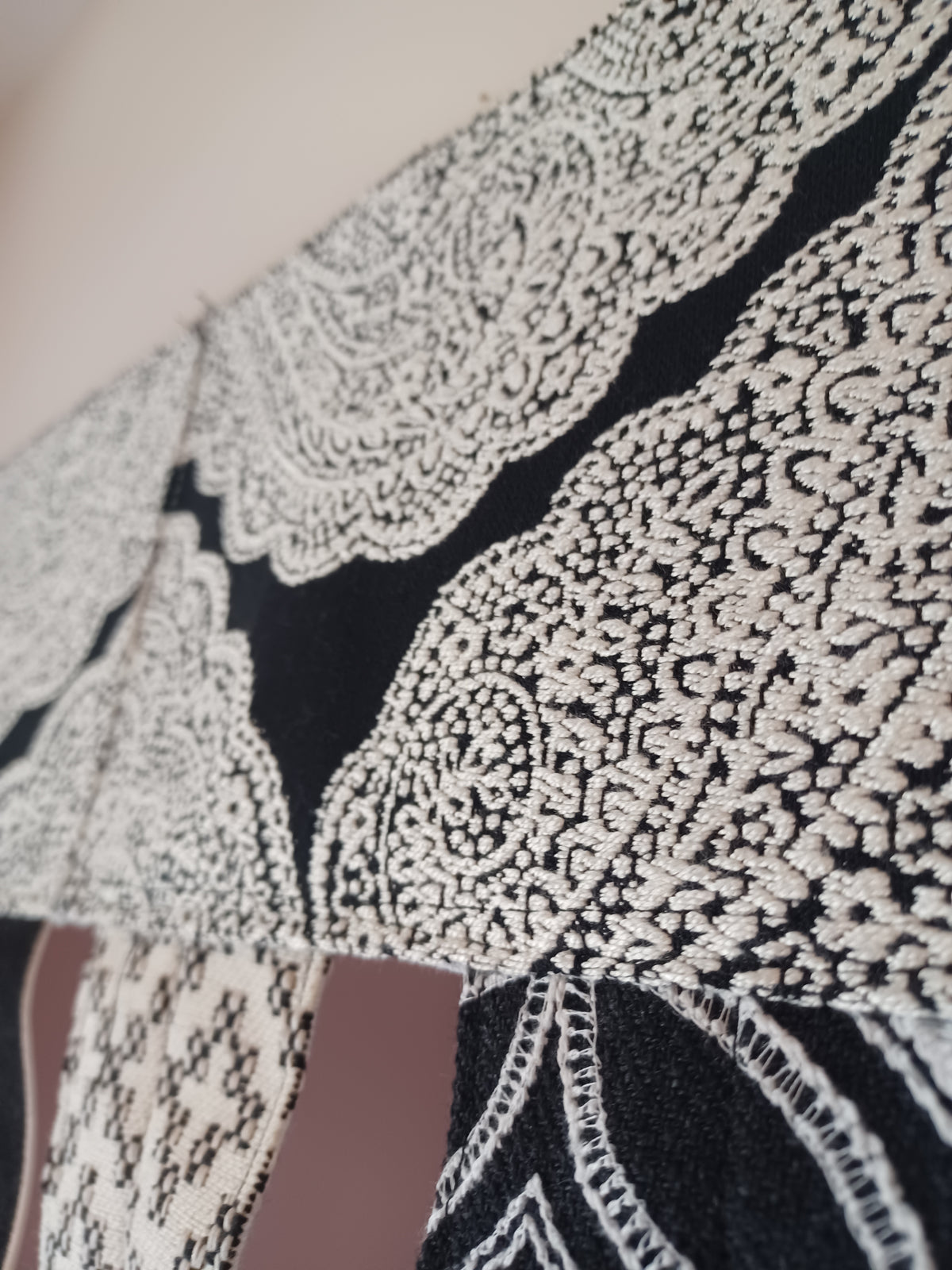Handmade toran door hanging in shades of black and off-white